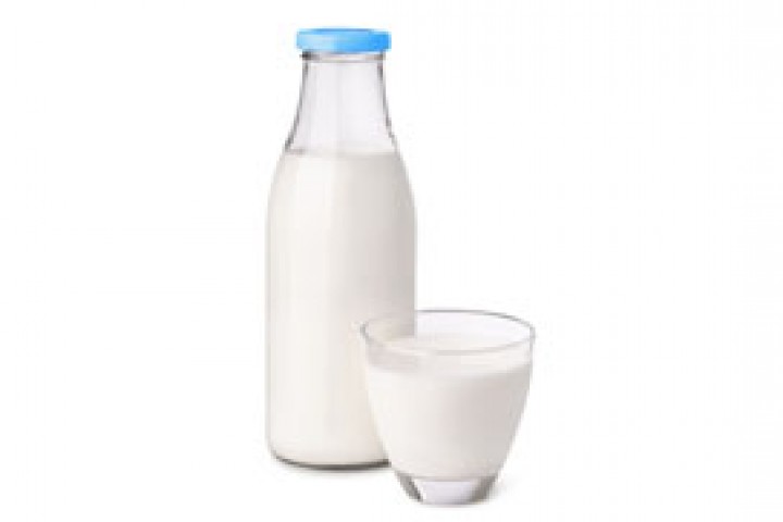bottle and glass of milk isolated on white
